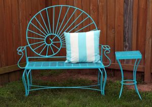 1 outdoor metal bench and table in the color aqua with decorative pillow