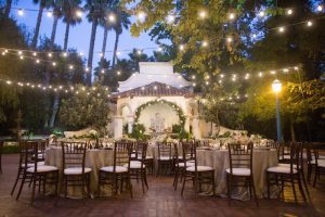 1 outdoor wedding with string lights and table settings