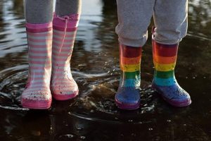 1 two kids wearing colorful wellies