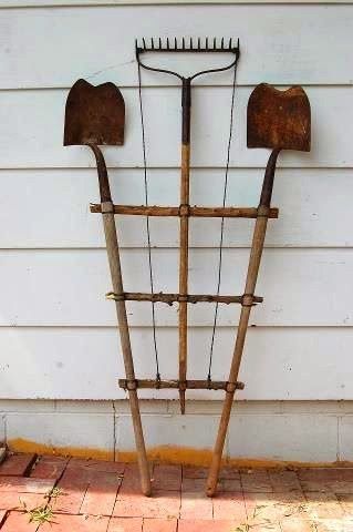 three old tools attached together to form a trellis