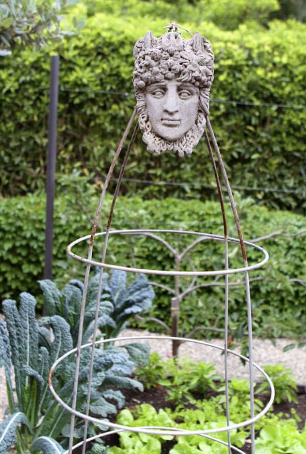cone-shaped trellis with mask on top