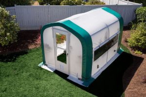 1 portable greenhouse in backyard