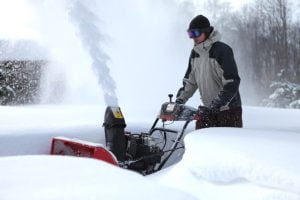 1 man using snow blower