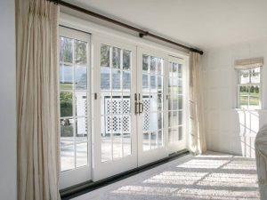 1 patio door with beige curtains