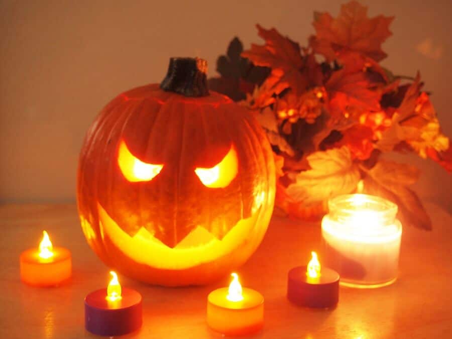 jack-o'-lantern surrounded by candles