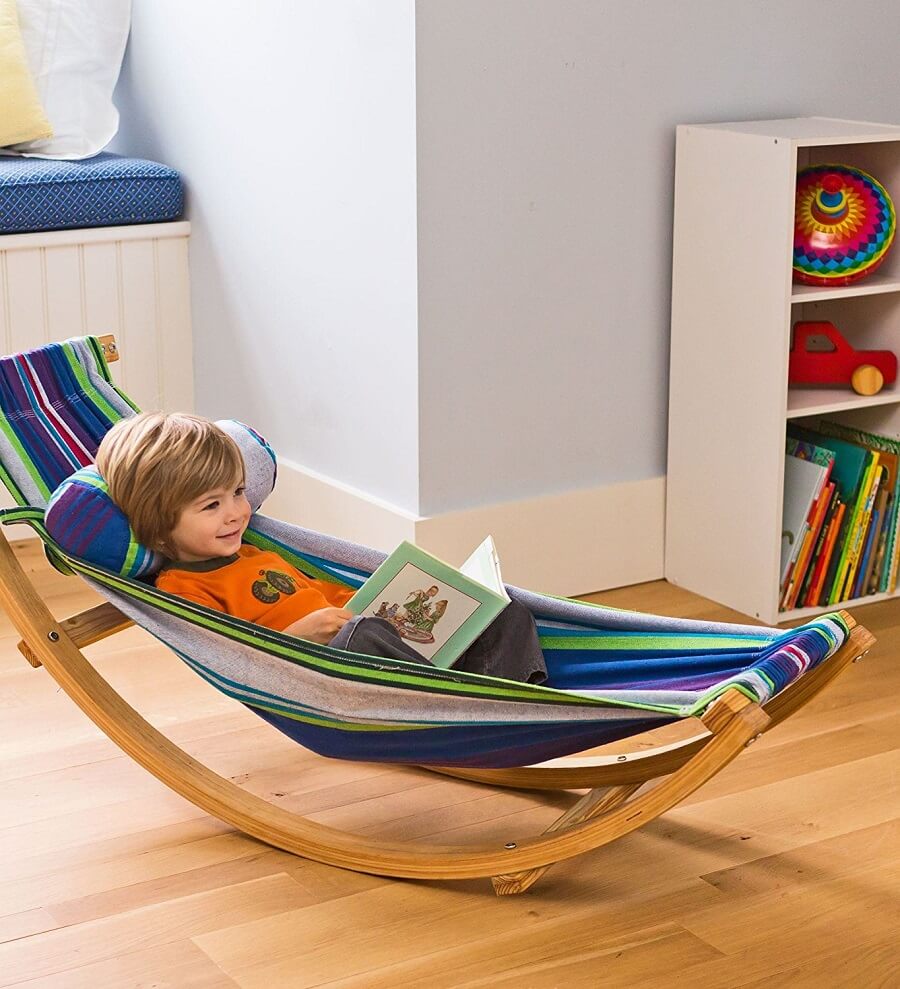 young kid reading in a hammock