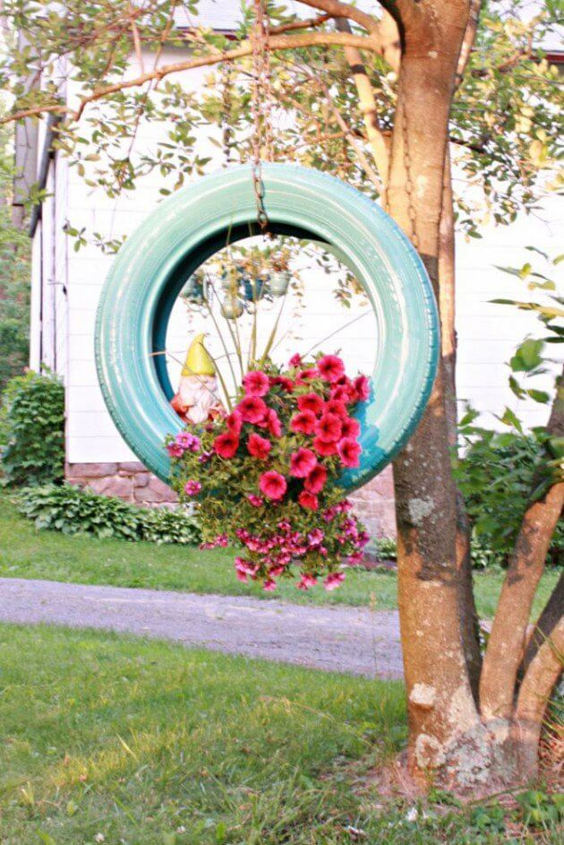 blue tire used as a planter, hanging planters