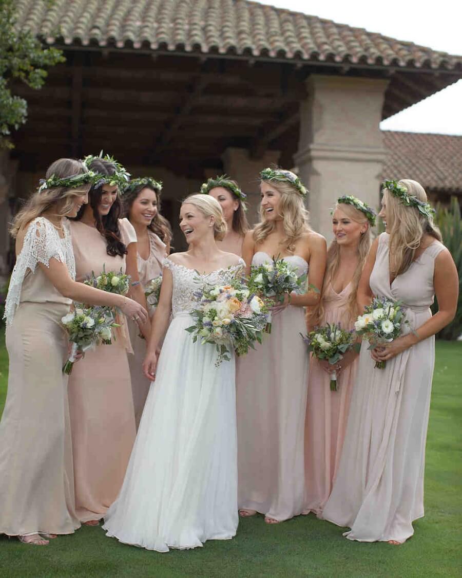 bride posing with her bridesmaids, spring wedding ideas
