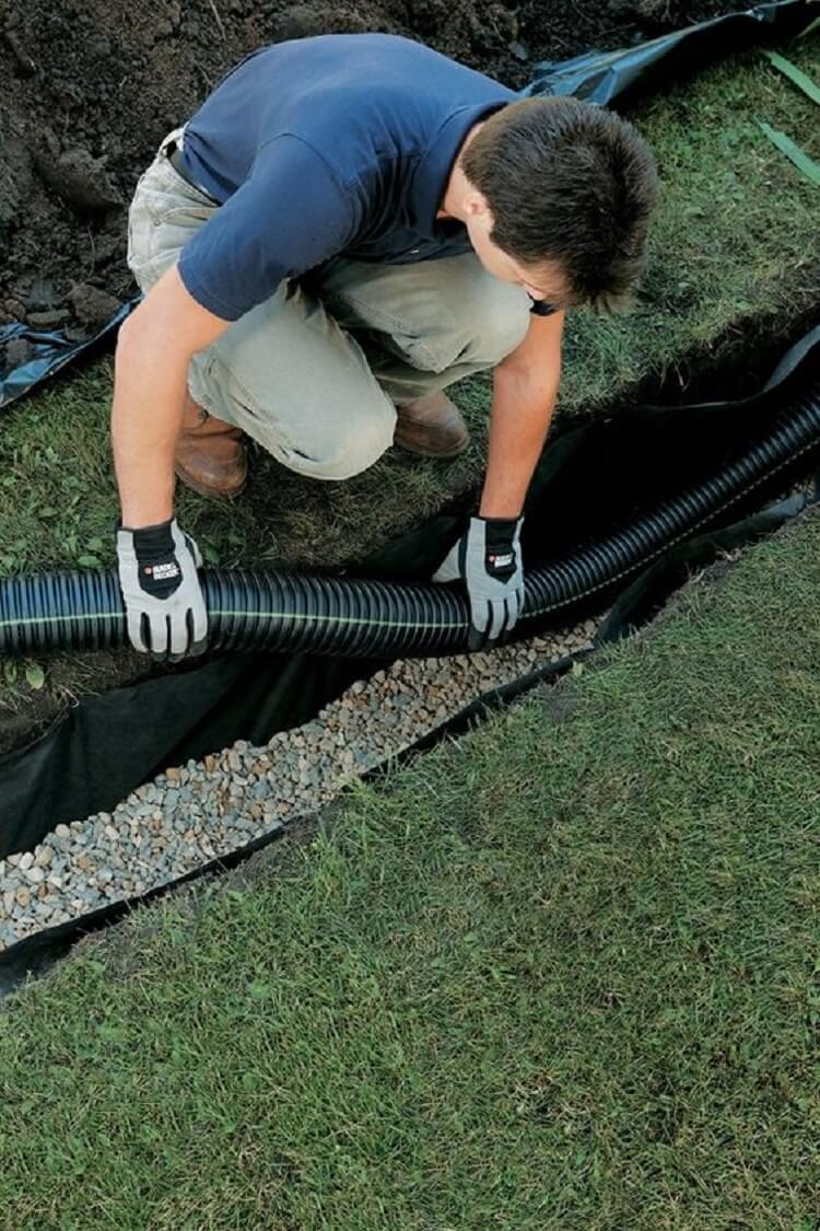 Installing pipe on French drain