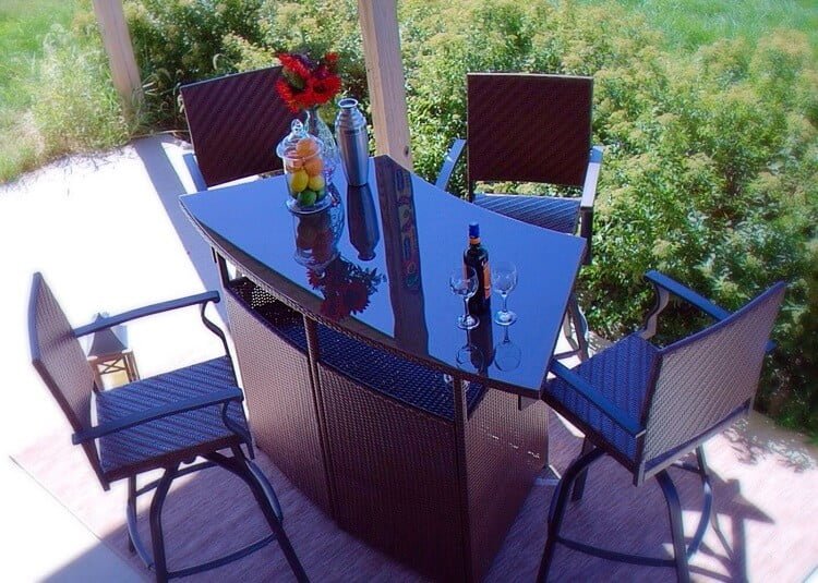 Outdoor bar set from Palmerton Landing with glass top and four chairs