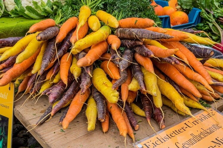 Mound of carrots of different varieties and colors