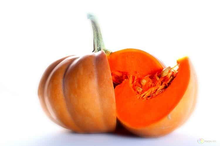 Pumpkin slice next to a pumpkin