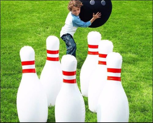 kid playing oversized bowling