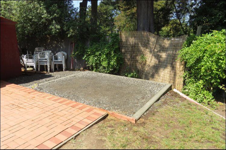 Square concrete patio lined up next to another concrete slab