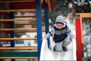 child using a slide