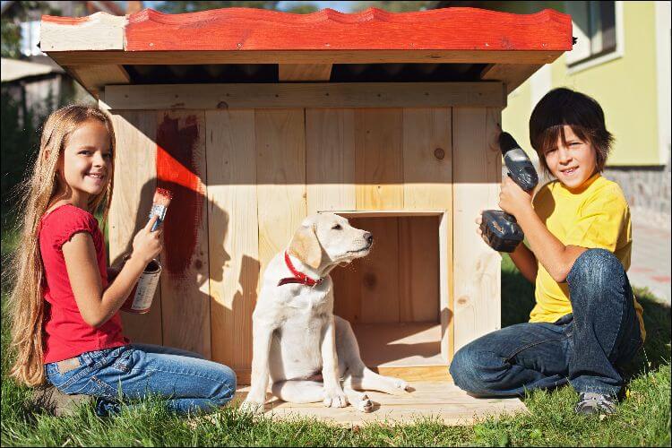 how to build a dog house two children building a dog house