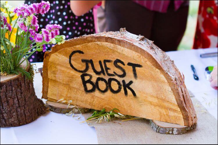 winter wonderland wedding centerpieces log centerpiece that says 'guest book'