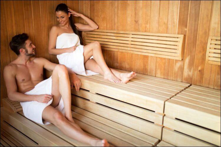 DIY outdoor sauna couple relaxing in the sauna