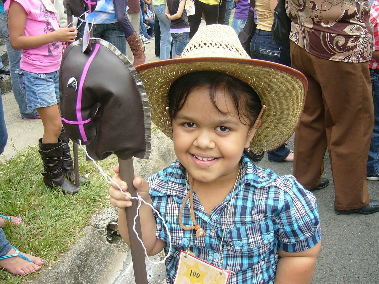 kid on a cowboy hat